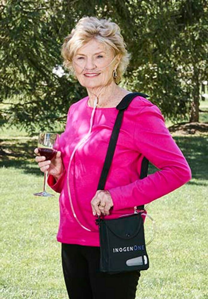 lady wearing inogen one 4 portable oxygen concentrator