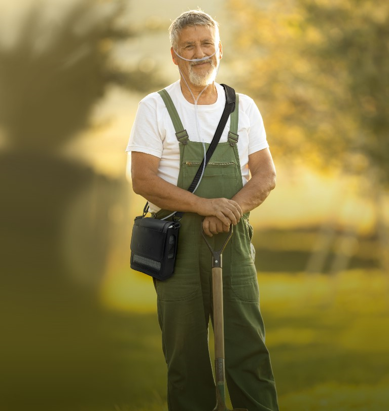 OxyGO Next POC shown over shoulder while gardening